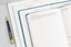 An array of organization and productivity notebooks next to a pen.