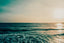A landscape photo of a blue green ocean and horizon