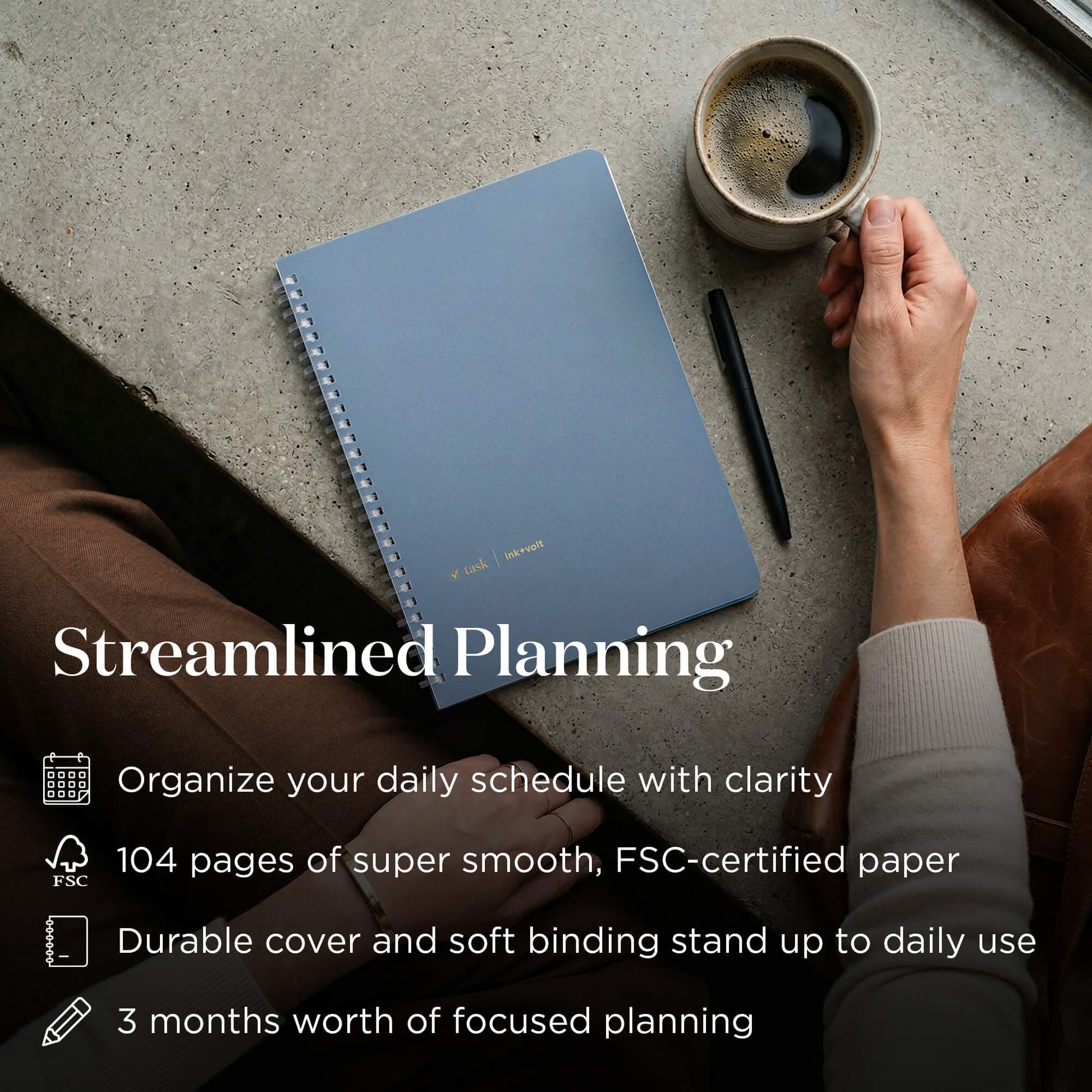 Blue task planner with a cup of coffee and a pen on a concrete surface, with text about streamlined planning.